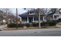 Charming two-story home with a screened-in porch and landscaped front yard at 540 Langhorn Sw St, Atlanta, GA 30310