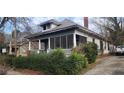 Charming two-story home with a screened-in porch and ample greenery at 540 Langhorn Sw St, Atlanta, GA 30310