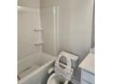 Bathroom featuring a clean white tub/shower combo and a toilet with bidet attachment at 3765 Davis Cir, Duluth, GA 30096