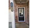 Close-up of the front door with glass insert and brick facade, displaying the house number at 3765 Davis Cir, Duluth, GA 30096