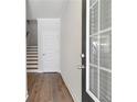 Inviting entryway with hardwood floors, a staircase, and natural light at 2989 Chene Pl, Duluth, GA 30097