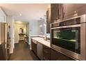 Stylish kitchen equipped with stainless steel appliances, sleek cabinets, and a farmhouse sink, adding a modern touch at 1101 Juniper Ne St # 721, Atlanta, GA 30309