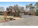 Handsome home with an attached garage and beautifully landscaped grounds at 4388 Lochsa Ln, Suwanee, GA 30024