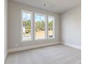 Bright bedroom with large windows providing ample natural light and neutral carpet at 38 Lakeview Pt, Dallas, GA 30157