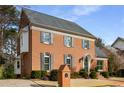 Brick home featuring detailed trim, gray shutters, manicured lawn and brick mailbox at 1535 Sheridan Ne Walk, Atlanta, GA 30324