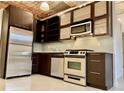 Modern kitchen with stainless steel appliances, granite countertops, and custom cabinetry at 170 Boulevard Se # E005, Atlanta, GA 30312