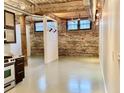 Open layout with exposed brick walls, high ceilings, and industrial-style details at 170 Boulevard Se # E005, Atlanta, GA 30312