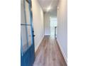 Inviting entryway with light LVP flooring, leading to the home's interior at 2407 Malster Ln, Lawrenceville, GA 30043