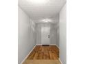 Entryway showcasing hardwood floors and neutral wall paint at 6336 Lake Valley Pt, Lithonia, GA 30058