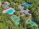 Aerial view of community amenities including pool, tennis courts, basketball courts and playground at 3162 Abbey Sw Dr, Atlanta, GA 30331
