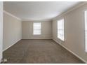 Spacious bedroom with neutral walls, carpeted floors, and natural light from windows at 2800 Kingston Ter, Atlanta, GA 30344