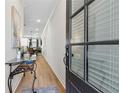 Elegant entryway with wood floors, a glass door, and view of the dining room at 2980 Ferrington Way, Smyrna, GA 30080