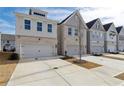 Home exteriors with neutral color schemes, two-car garages and modern design at 2980 Ferrington Way, Smyrna, GA 30080