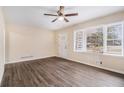 Bright living room with hardwood floors, a ceiling fan, and ample natural light at 2328 Starline Dr, Decatur, GA 30032
