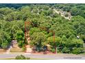 An aerial view of wooded homesite surrounded by mature trees at 1491 S Hairston Rd, Stone Mountain, GA 30088