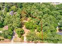 An aerial view of wooded homesite surrounded by mature trees at 1491 S Hairston Rd, Stone Mountain, GA 30088