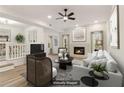 Bright living room with fireplace, ceiling fan, modern decor, and neutral color palette at 1908 Variations Ne Dr, Atlanta, GA 30329