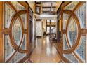 Grand foyer with custom designed wooden entry doors, hardwood floors, and stairway at 2353 Habersham Sw Dr, Marietta, GA 30064