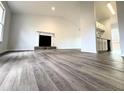 Spacious living room featuring neutral walls, wood-look flooring, and a decorative fireplace at 782 Fox Valley Dr, Stone Mountain, GA 30088