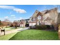 Attractive brick-front home with a manicured lawn, spacious driveway, and convenient two-car garage at 5466 Vinings Lake Way, Mableton, GA 30126