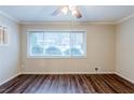 Bright living room with hardwood floors, neutral paint, and a large window offering natural light at 2916 Lloyd Rd, Decatur, GA 30034