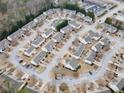 An aerial view shows the home nestled in a community with manicured lawns and mature trees at 46 Darbys Crossing Ct, Hiram, GA 30141