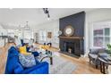 Bright living room with a cozy fireplace, stylish furniture, and hardwood floors at 726 Brookline Sw St, Atlanta, GA 30310