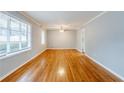 Spacious living room with hardwood floors and plenty of natural light from large windows at 3368 Windsor Castle Ct, Decatur, GA 30034