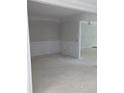 Open floor plan room featuring wall panels that seamlessly connects to other spaces at 8033 White Stone Blvd, Douglasville, GA 30135