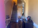 Inviting entryway with staircase, warm paint and stylish decor at 2610 Gadsen Walk, Duluth, GA 30097