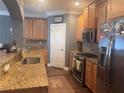 Beautiful kitchen featuring stainless appliances, ample counter space, and stylish cabinetry at 2610 Gadsen Walk, Duluth, GA 30097