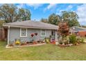 Charming single-story home featuring a beautifully landscaped front yard, a well-manicured lawn, and curb appeal at 5346 Lee Cir, Forest Park, GA 30297