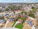Expansive aerial view of the property, revealing its prime location within a lush, residential community at 3207 Haleys Way, Conyers, GA 30013