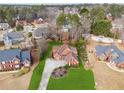 Aerial shot showcases the beautiful home, green lawn, and the surrounding neighborhood at 3207 Haleys Way, Conyers, GA 30013