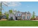 Beautiful brick-and-siding two-story home with a well-manicured lawn and mature trees at 8023 White Stone Blvd, Douglasville, GA 30135