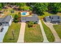 Wide aerial view of the house showing its location between neighboring houses at 3625 Knoll Crest Trl, Buford, GA 30519