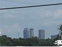 Distant skyline view featuring office towers, captured on a partly cloudy day at 2134 Nw Abner Nw Pl, Atlanta, GA 30318