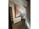Hallway with built-in shelving, stairs, and landing at 4707 Mariners Way, Stone Mountain, GA 30083
