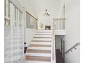 Welcoming entryway features a staircase, high ceilings, and a view of the living room at 3278 Greenhill Dr, Villa Rica, GA 30180