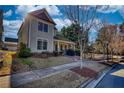 Lovely two-story home featuring a welcoming front porch, garden and meticulously kept lawn at 5114 Arnold St, Covington, GA 30014