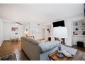 Bright living room with a fireplace, dining area, and wood-look flooring at 223 Smokerise Se Cir, Marietta, GA 30067