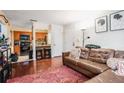 Open living area with hardwood floors flowing into the eat-in kitchen area at 3175 Seven Pines Ct # 207, Atlanta, GA 30339