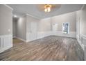 Spacious living room featuring hardwood floors, high ceilings, and plenty of natural light at 4879 Pinnacle Dr, Stone Mountain, GA 30088