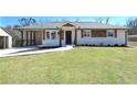 Charming renovated house with white painted brick and new architectural details at 900 King Rd, Jonesboro, GA 30236