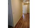 Hallway featuring modern laminate flooring and neutral-toned walls at 770 Parkway Rd, Union City, GA 30291
