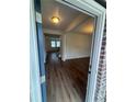 Inviting entryway with hardwood floors that offers an open and bright view through to the living space at 1857 Kingsmere Run Dr, Loganville, GA 30052