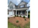 Charming two-story home with a brick facade, attached two-car garage, and well-manicured lawn at 1857 Kingsmere Run Dr, Loganville, GA 30052