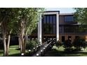 Modern home with beautiful landscaping and a walkway with lights, showcasing a grand entrance with large windows at 4250 Carmain Ne Dr, Atlanta, GA 30342