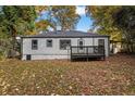 Well-maintained exterior with a small back deck, and a leafy yard at 1013 Columbia Dr, Decatur, GA 30030