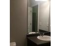 Bright bathroom featuring a large mirror and a functional sink at 266 Valley Xing, Canton, GA 30114